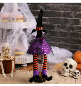 Detail of Halloween witch hat wine bottle cover with sequin bat and orange striped legs