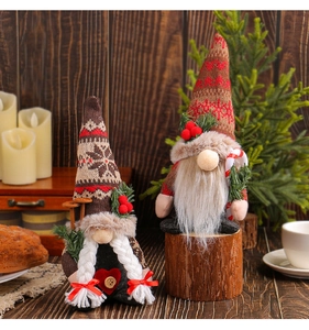 Close-up of knit Christmas gnomes set with snowflake hats and candy cane details