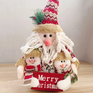 Christmas plush gnome set with Santa and snowmen figurines on a wooden table decoration