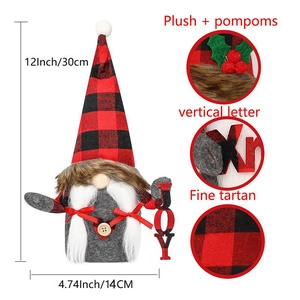 Detail view of 12-inch plush Christmas gnome with red tartan hat and JOY sign