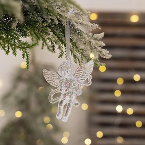 Iridescent acrylic Christmas angel ornament with wings on a festive tree branch
