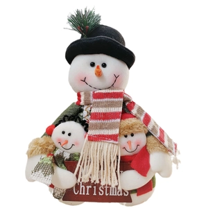 Three plush Christmas snowmen holding a Merry Christmas sign for home decoration