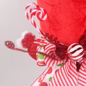 Christmas tree topper hat made of red velvet with candy canes and striped ribbons