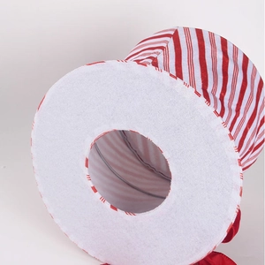 Detail view of red and white striped Christmas tree topper with foldable metal frame