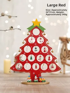 Detail of red wooden Christmas tree desk decor with mini ornaments and toy train base