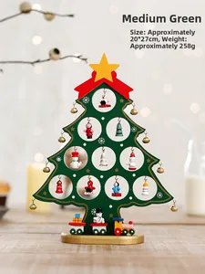 Close-up of green wooden Christmas tree with miniature ornaments and toy train detail