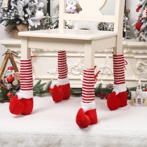 Christmas striped elf chair leg covers with red ribbons and pom poms for floor protection
