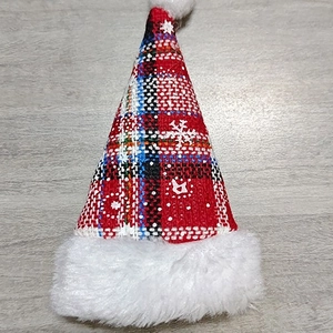 Mini plaid Christmas hat cutlery holder with white snowflake patterns and plush trim