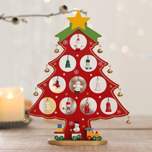Red wooden Christmas tree desk ornament with mini ornaments and a small toy train