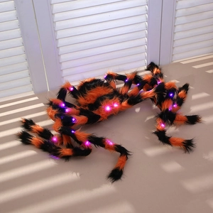 Close-up of 125cm Halloween giant spider with orange stripes and glowing purple LED lights