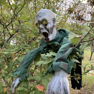 Detailed realistic zombie prop with glowing eyes for Halloween outdoor yard decoration