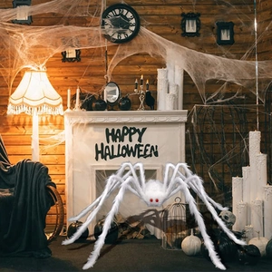 Giant white plush spider with red eyes for Halloween indoor fireplace scene decoration