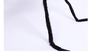 Detailed macro view of flexible black furry legs for 125cm animated Halloween spider prop