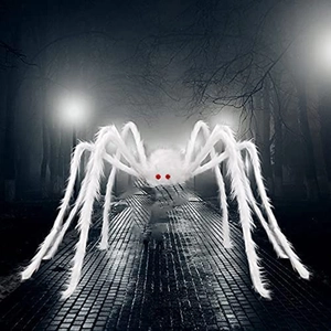Giant white plush Halloween spider with red eyes on a misty dark road for spooky decor