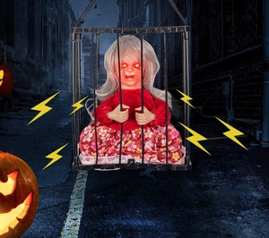 Detail of Halloween cage ghost with glowing red eyes and tattered floral clothing