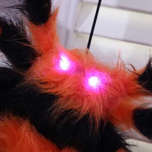 Glow-in-the-dark 125cm Halloween spider with orange black stripes and purple LED eyes