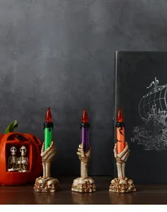 Three-piece set of Halloween skeleton hand LED candles in green, purple and orange colors