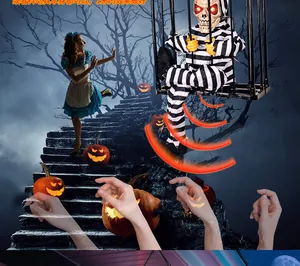 Close-up of Halloween hanging prisoner in cage with glowing red eyes and motion sensor
