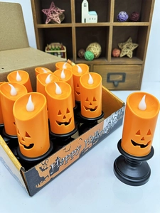 Set of 12 Halloween pumpkin LED candles with smiling faces and black vintage bases