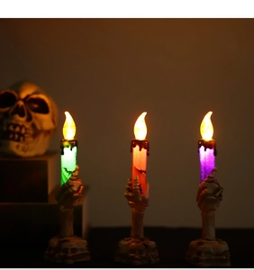 Three-piece set of Halloween LED candle lights featuring detailed skeletal hand holders