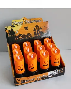Close-up of 12-piece orange LED pumpkin candles in a Halloween-themed display box