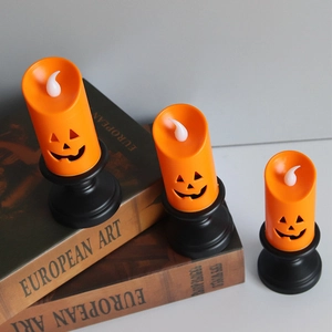 Three orange LED pumpkin candles with hollow faces on vintage books for Halloween decor