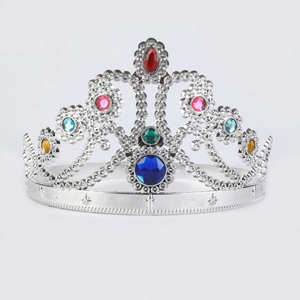 Close-up of a silver tiara headband featuring hollow carvings and multi-colored gemstones