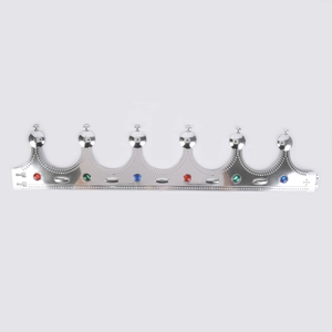 Detailed view of silver plastic toy crown with colorful gemstones and bead relief