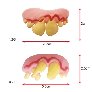 Detailed view of two funny Halloween dog dentures with weight and size specifications