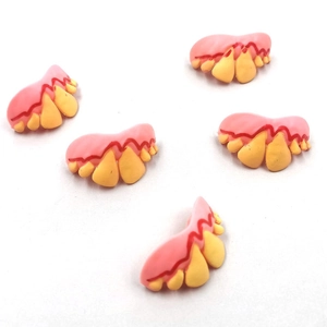 Macro detail of funny dog dentures set with yellowed teeth for Halloween pranks