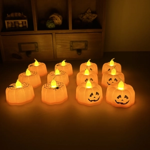 Set of 12 Halloween LED pumpkin tea lights with spider web and classic jack-o-lantern faces