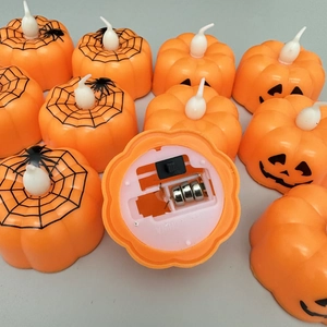 LED Halloween pumpkin lantern tea lights with spider patterns and bottom battery switch