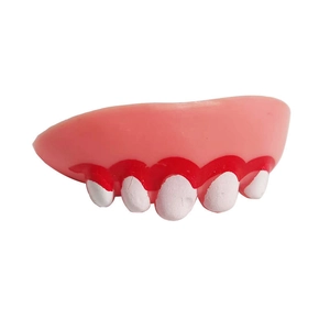 Detailed close-up of funny Halloween prank dog dentures with pink gums and white teeth