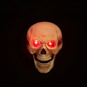 Halloween skull decor with glowing red LED eyes and realistic aged bone texture detail