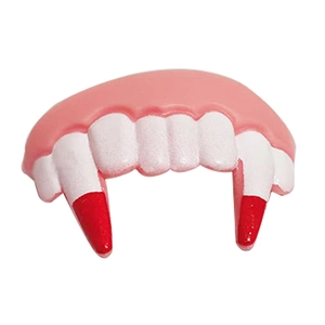 Macro detail of vampire fangs prop with realistic blood tips for Halloween prank costumes