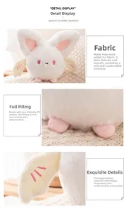 Detail display of soft plush bat toy showing white faux rabbit fur and wing embroidery