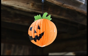 Décoration d'Halloween citrouille en papier alvéolé orange suspendue avec feuille verte