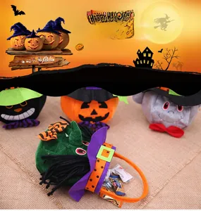 Detail of soft plush Halloween gift bags featuring pumpkin, witch and ghost characters