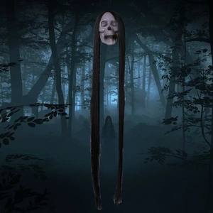 Creepy Halloween skull decor with long black hair hanging in a foggy dark forest scene