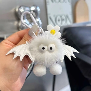 Cute white plush monster keychain with bat wings and yellow flower charm for bags