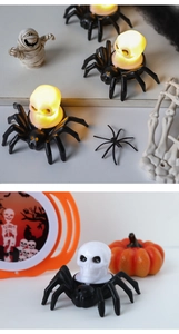 Detail of Halloween spider skull LED lamp showing warm glow and decorative plastic texture