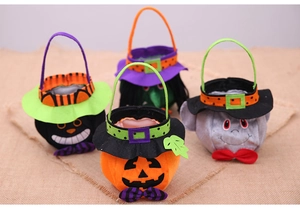 Close-up of four Halloween candy bags with pumpkin, witch, cat and ghost characters