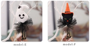 Detail of plush Halloween ghost and witch cat ornaments with small metal bells