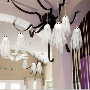 Hanging white ghost party decorations with mesh fabric and rustic twine for Halloween events
