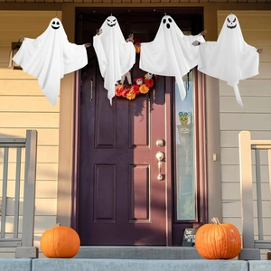 Detail of four hanging Halloween ghost decorations with unique facial expressions and skull hands