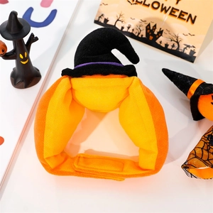 Detail view of plush pumpkin pet hat with black wizard topper and Velcro strap