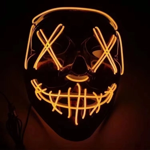 Close-up of orange LED wire stitching and X-shaped eyes on a black horror mask