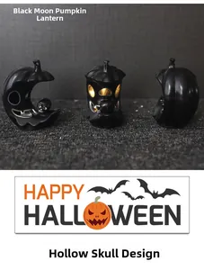 Detail of Halloween black moon pumpkin lamp with skull and glowing yellow LED lights
