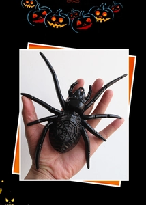 Detail of large realistic black spider prop with web texture for Halloween decor