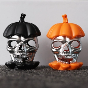 Halloween skull lanterns in black and orange colors with LED lights for festive decor